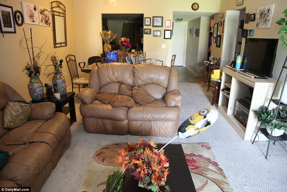 The shooter's living room looks normal and untouched, but investigators went through it on Sunday